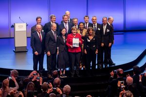 Picture of Federal Chancellor of the Republic of Germany Angela Merkel receives a hard copy of the B20 Germany Recommendations